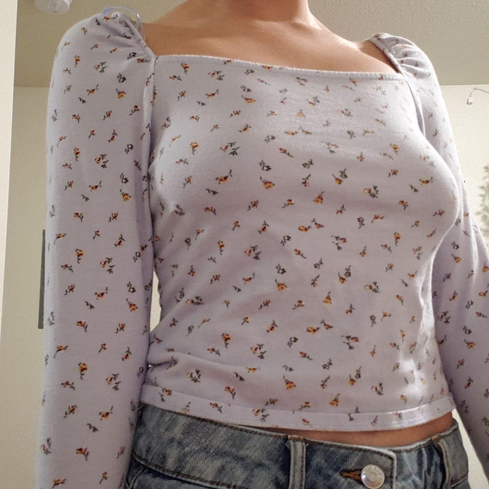 purple top with puffy sleeves